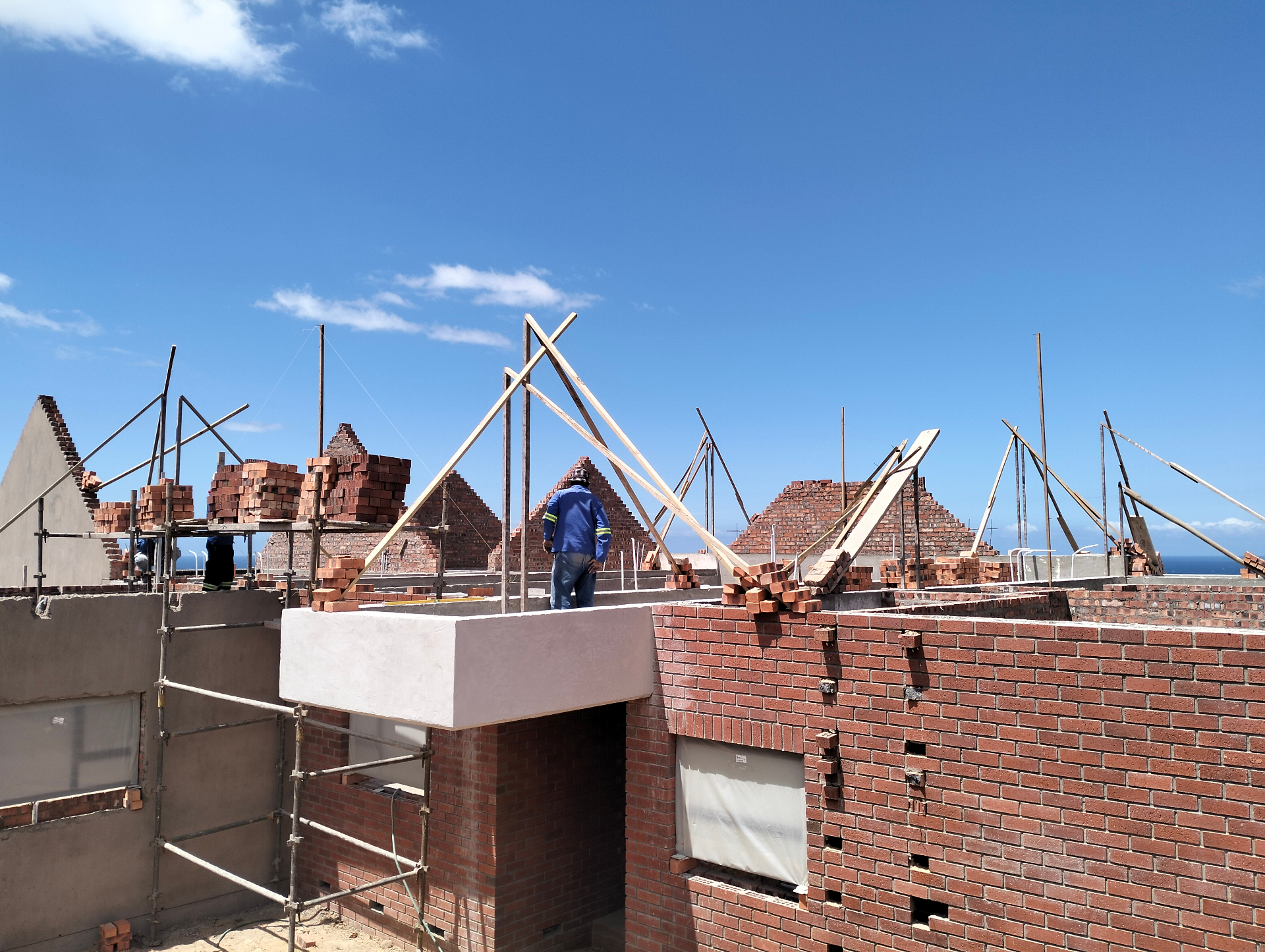 Roof truss installation on brick home