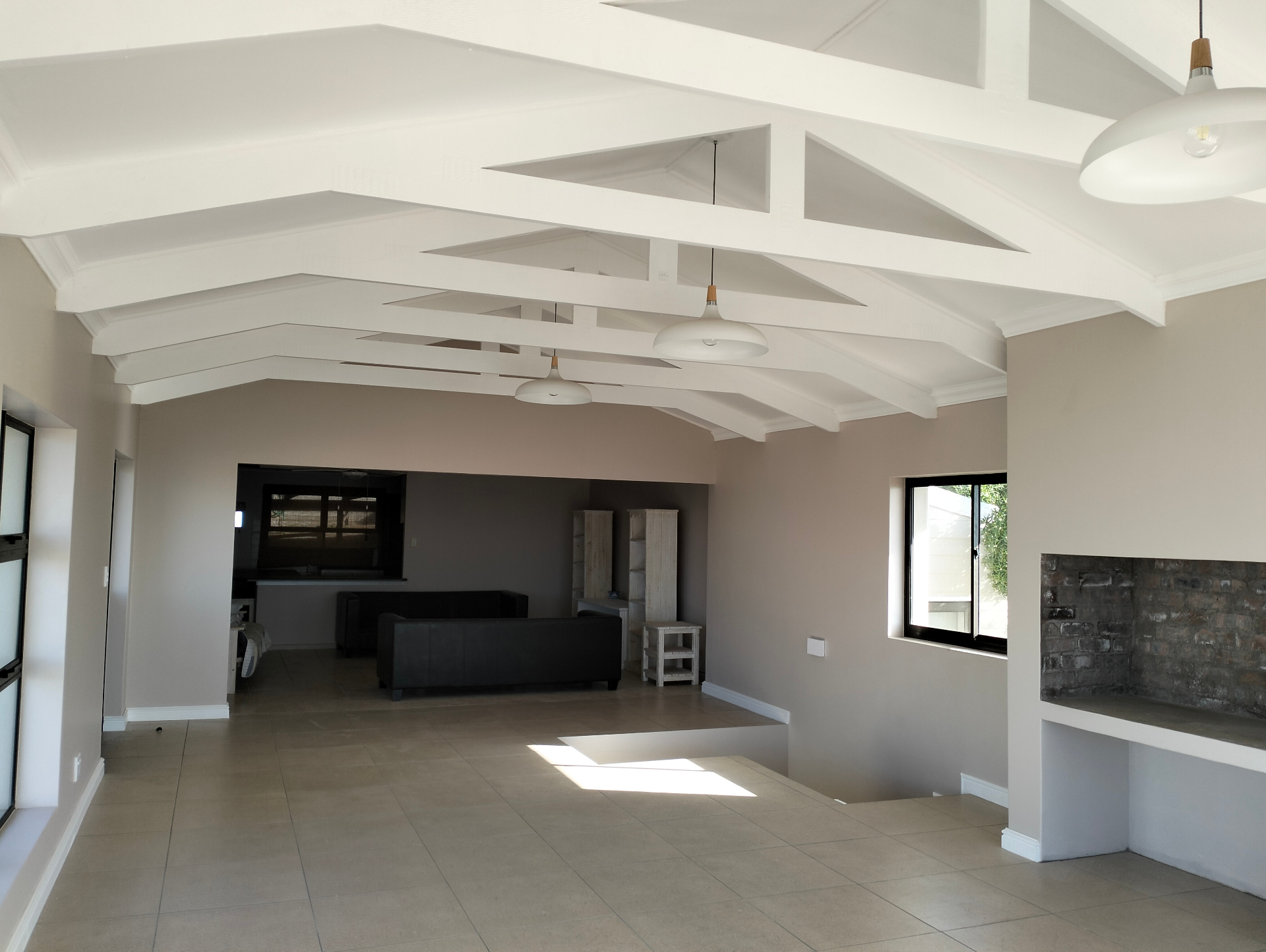 Finished living area with exposed trusses